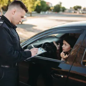 Police Officer Speaking with women