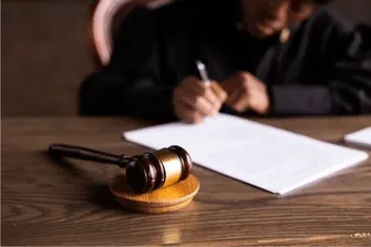 Judge signing paper